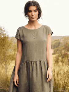 Pleated Hem Dress Logo